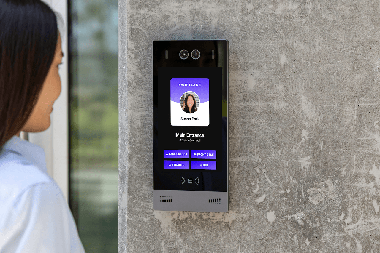 woman using modern intercom