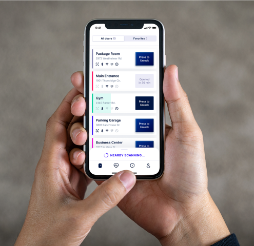 Person holding Swiftlane mobile app door unlock