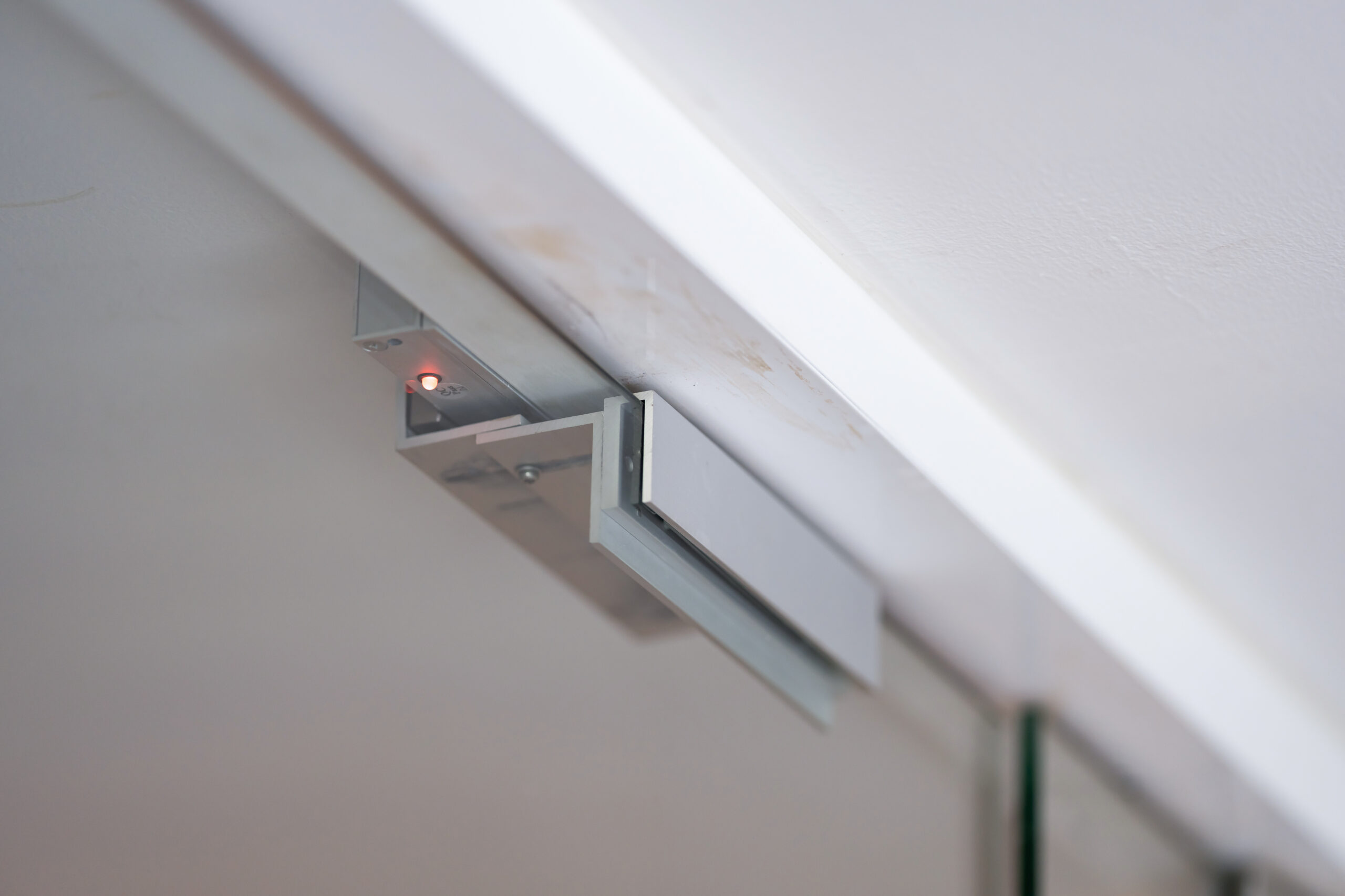 maglock door release mechanism on door frame