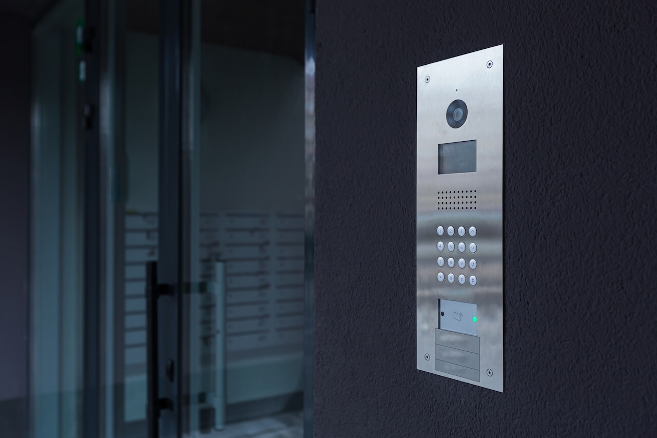 video intercom mounted on a black wall