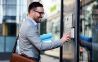 Man pressing the buttons of an intercom system
