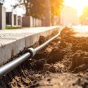 trenching sidewalk for conduits