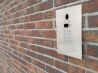 intercom on a brick wall