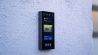 Swiftlane intercom mounted on a brick wall