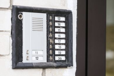 traditional apartment intercom at building entrance