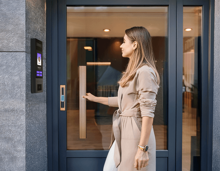 woman entering a salon suite through video intercom